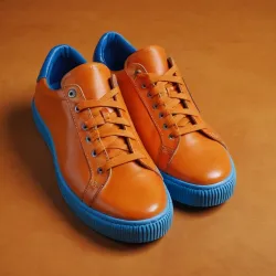 photo of #7 orange sneakers blue sole