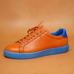 photo of #7 orange sneakers blue sole