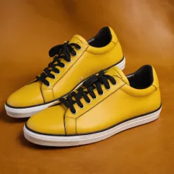 photo of #8 yellow sneakers black sole