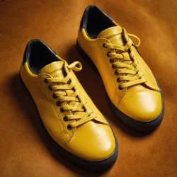 photo of #8 yellow sneakers black sole
