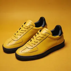 photo of #8 yellow sneakers black sole