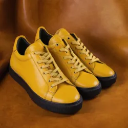 photo of #8 yellow sneakers black sole