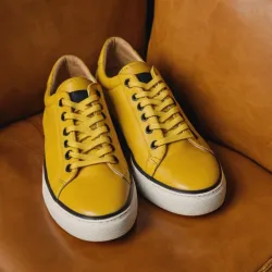 photo of #8 yellow sneakers black sole