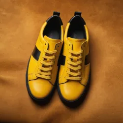 photo of #8 yellow sneakers black sole
