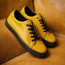 photo of #8 yellow sneakers black sole